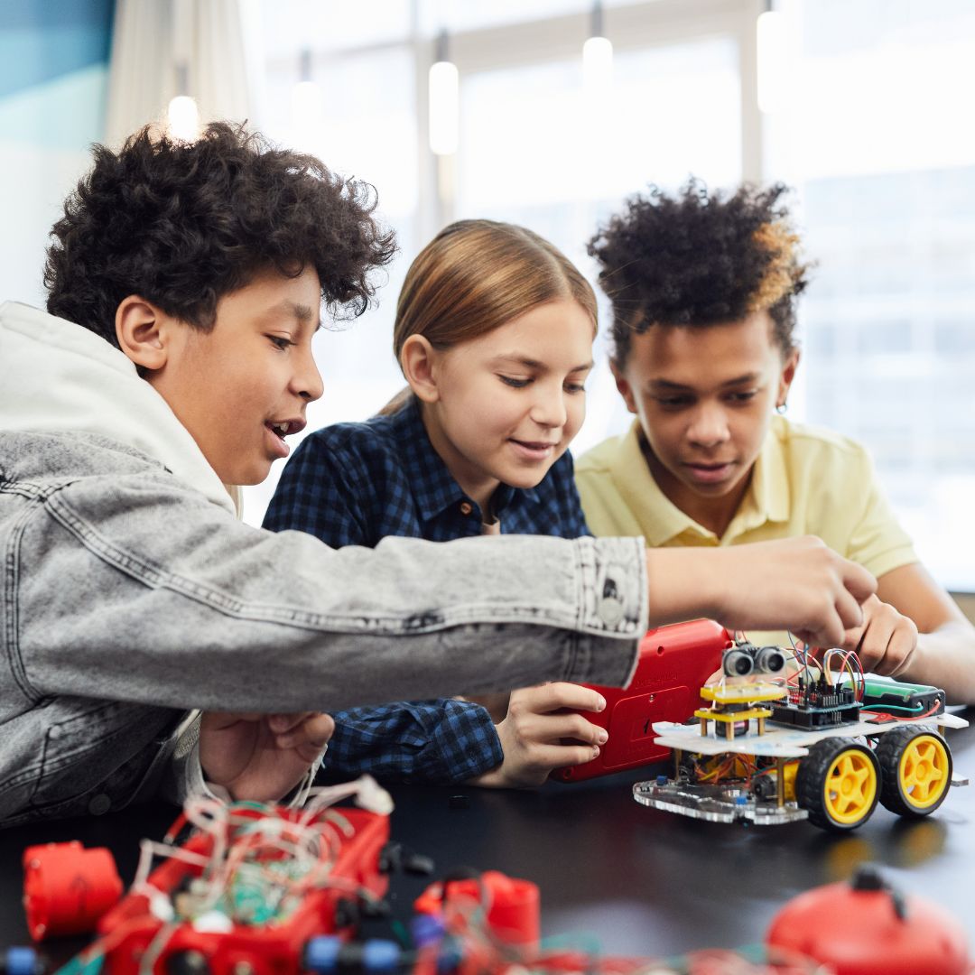 kids building mechanical vehicle